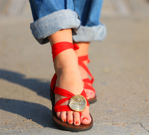 woman wearing sseko sandals in red 