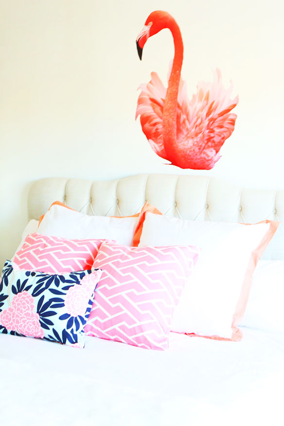 falmingo walls in bedroom and pink and white pillows 