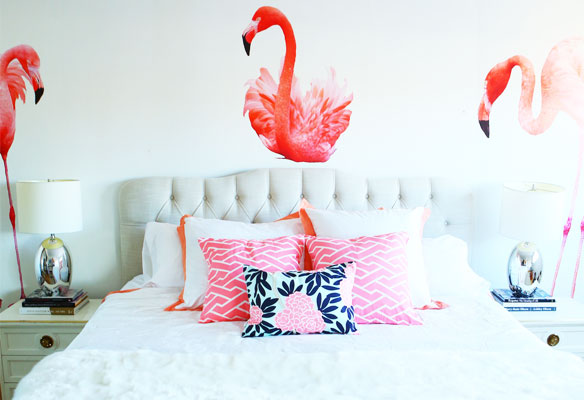 bed, night stand, and walls with flamingo wall paper