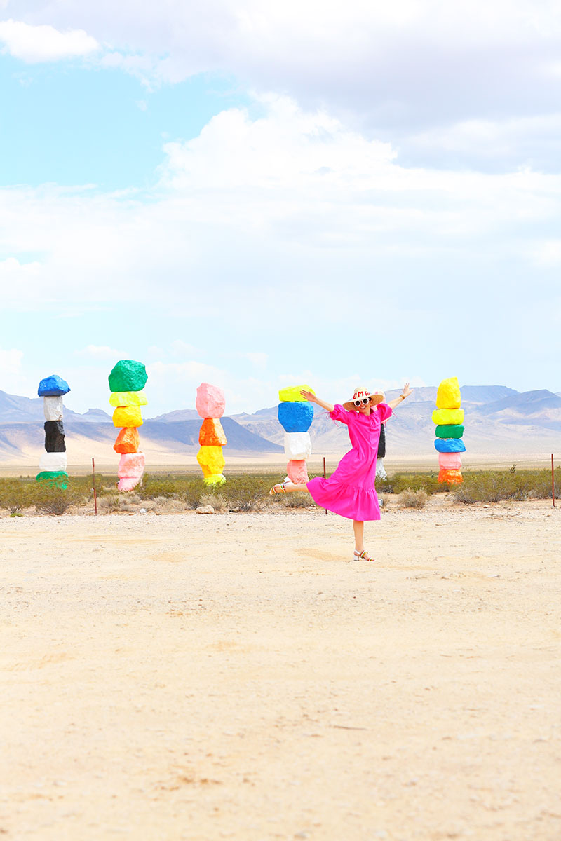 Kelly Golightly wears MDS Stripes pink garden dress to Seven Magic Mountains near Las Vegas, Nevada.