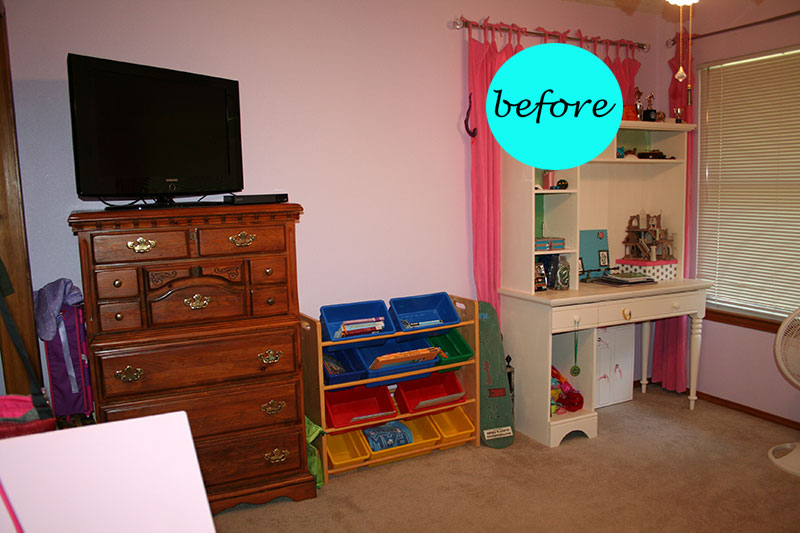 television, drawers, toys, and vanity in a bedroom