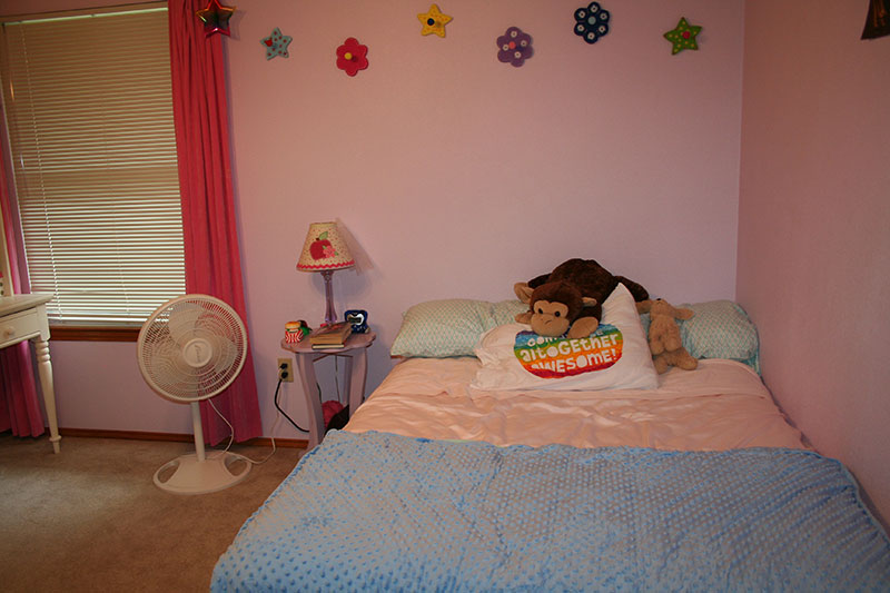 bed and electric fan for one room challenge