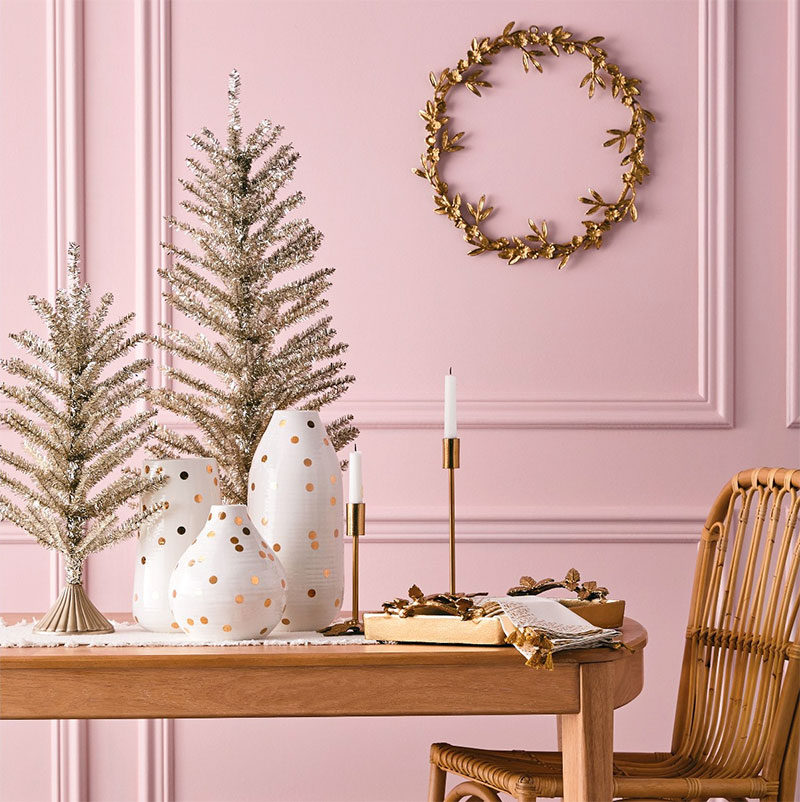 Gold metallic Christmas trees, white and gold polka dot vases and more stylish modern Christmas decor.