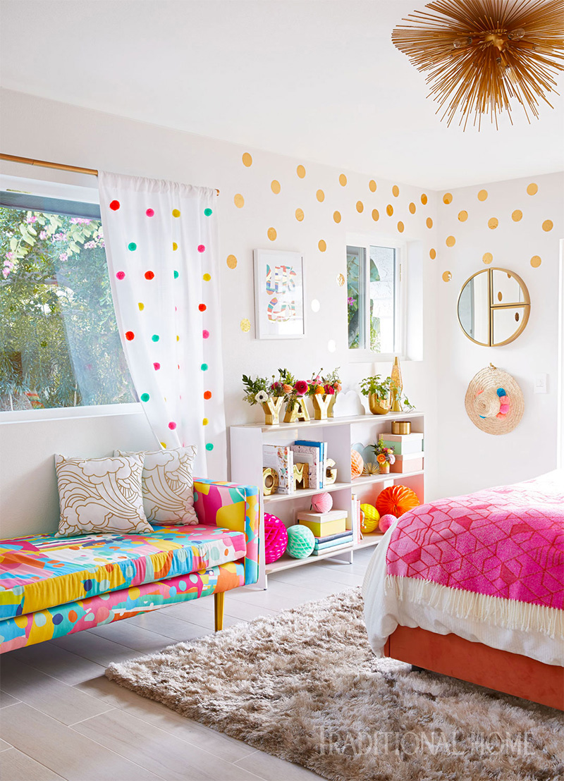 guest room with colorful sofa, bed, and decorations 