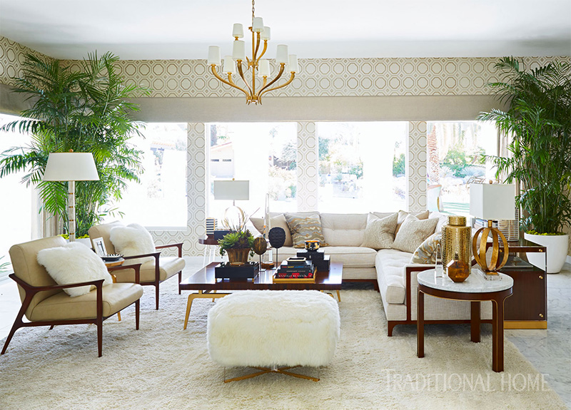 living room with chairs, indoor plants, and coffee table for traditional home magazine