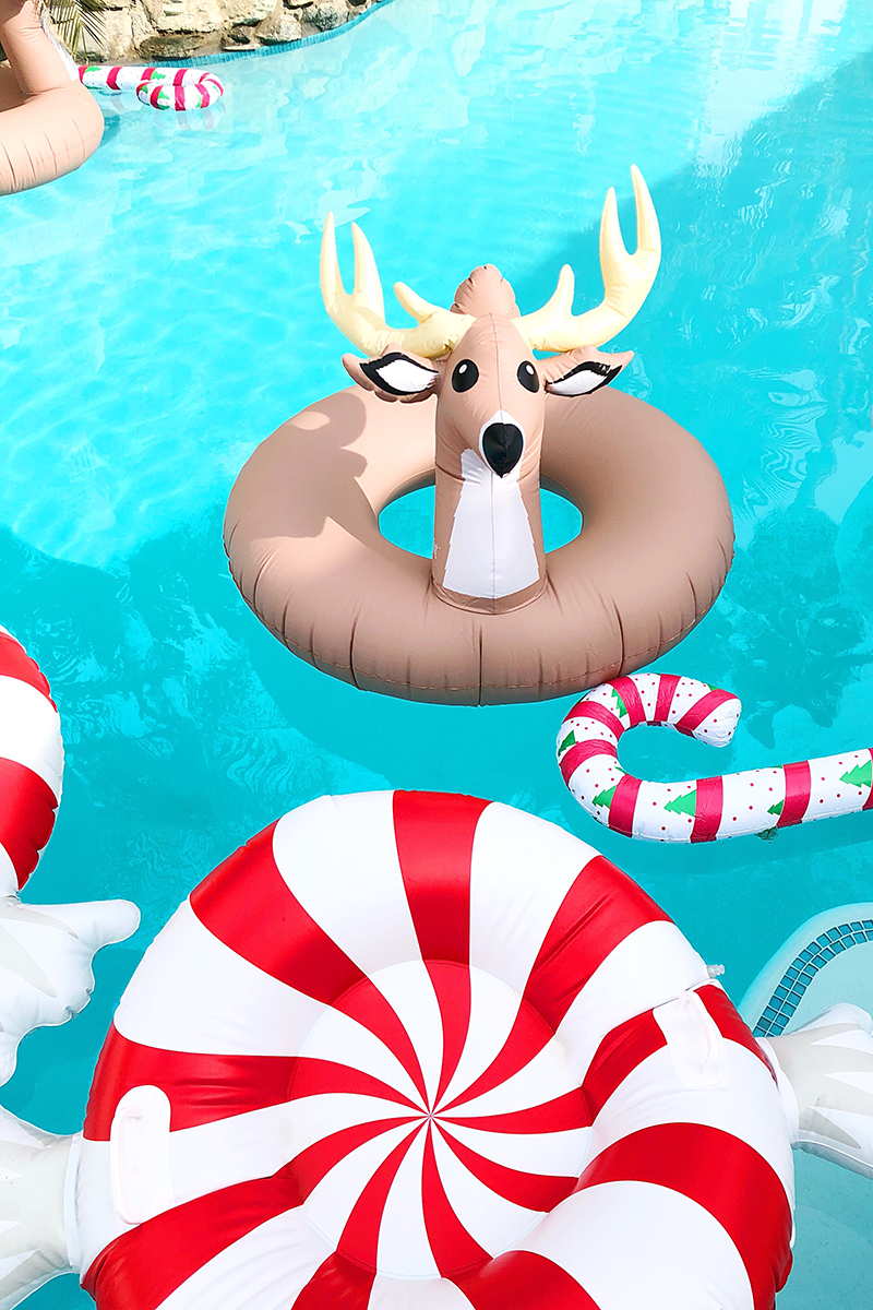 Peppermint pool floats, reindeer pool floats, and candy cane pool floats on a pool Christmas Decor in Palm Springs