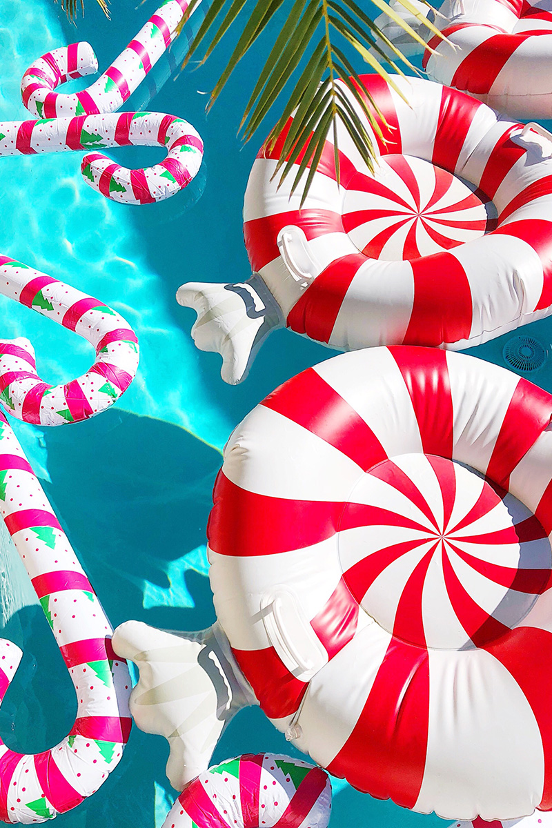 Peppermint Pool Floats floating on the pool for Christmas Decor in Palm Springs