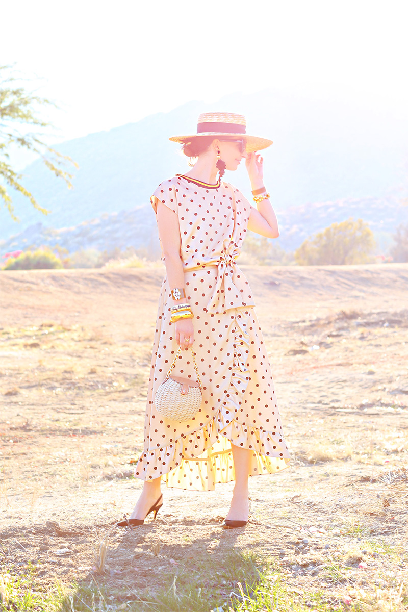 woman outdoors wearing a polka dot dress