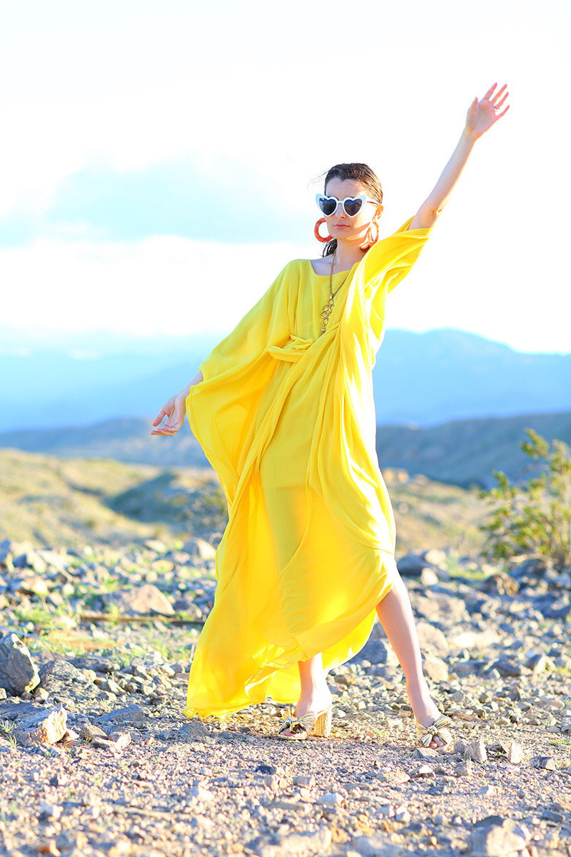 woman in yellow caftan sharing how to wear it