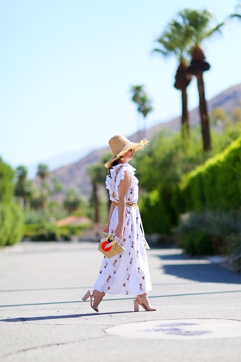 woman style white dress for fall with weaved hat and bag