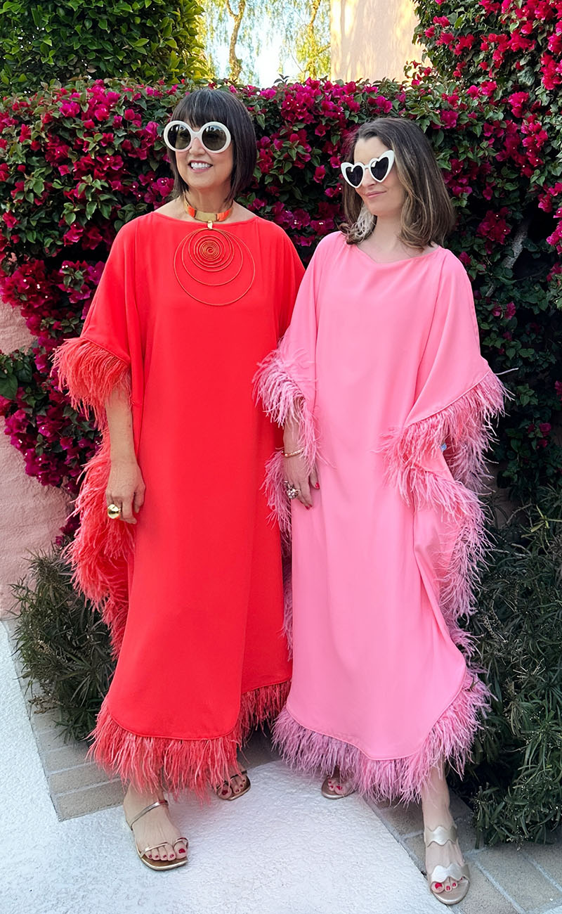 Top fashion blogger Kelly Golightly & fashion designer Trina Turk wear the Neena Caftan in tomato red and bubblegum pink at Marrakesh Club in Palm Springs.